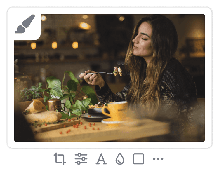 Photo of a woman enjoying a meal with image editing controls